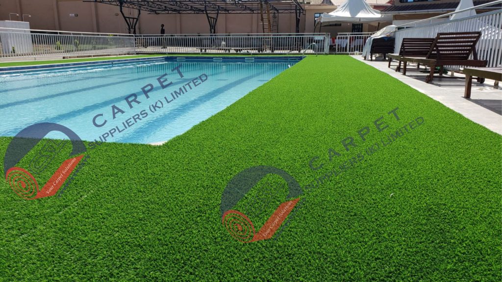 Artificial grass around a swimming pool